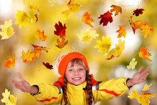 Girl In Autumn Orange Hat With Yellow Leaves. Outdoor.