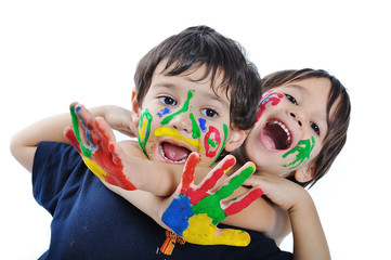 A little cute child with several colors on white