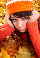 Wall Mural - girl in orange hat on leaves. autumn depression. outdoor.