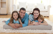 © WavebreakMediaMicro - Family on floor in living-room