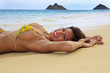 beautiful girl in a yellow bikini at the beach in Hawaii