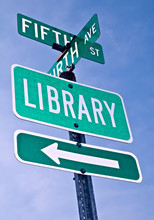 A Directional Roadsign  To The Library.