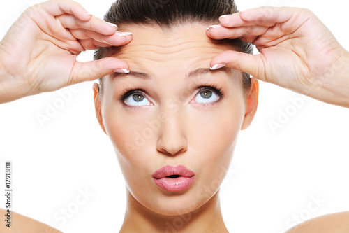 Fotografering female face with wrinkles on her forehead