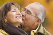 © Don Mason/Blend Images - Hispanic couple kissing outdoors