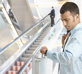 Canvas Print - Businessman checking time