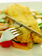 breaded fish fillet with vegetables