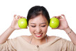 © ping han - woman holding green apple