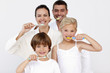 © WavebreakMediaMicro - Family cleaning their teeth in bathroom