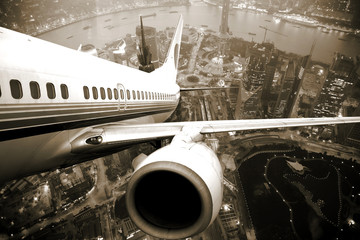 Poster - the airplane take off from the city night.