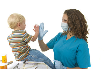 Health Care Professional gives toddler a high five