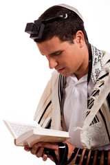 Wall Mural - Close up of a young  jewish man with book