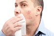 Man wiping lips traces from his face