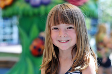 Pretty little girl smiling in park