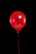 Red Party Balloon On Black