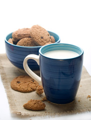 Wall Mural - Bowl of cookies with mug of milk