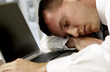 © gwimages - Man sleeping on laptop