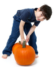 Boy Picking Pumpkins