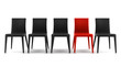 © Tiler84 - red chair among black chairs isolated on white background
