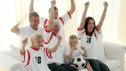 Wall Mural - Family on the sofa watching Football