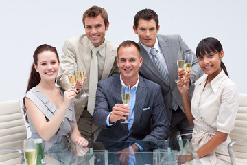 Wall Mural - Business team toasting with champagne in the office