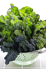 Dark green leafy vegetables in colander