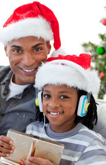 Wall Mural - Portrait of an Afro-American father and son at Christmas time