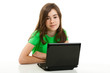 © Jacek Chabraszewski - Girl using laptop isolated on white background
