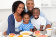 © WavebreakMediaMicro - Happy family having healthy breakfast