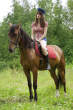 Fototapeta Konie - Brunette girl with horse