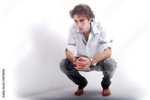 Jeune Homme Accroupi Buy This Stock Photo And Explore Similar Images At Adobe Stock Adobe Stock