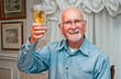 Happy senior man toasts retirement