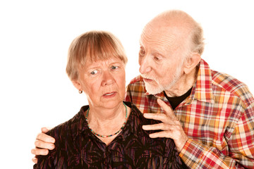 senior man sharing information with concerned wife