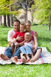 © WavebreakMediaMicro - Portrait of a smiling family having a picnic