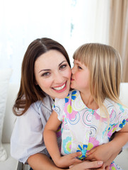 Wall Mural - Cute girl kissing her mother