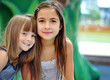 © BCFC - Portrait of two girls on a playground