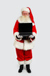 © Emin Ozkan - santa holding a notebook computer
