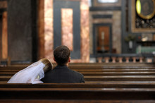 Bride And Groom Sitting In The Church