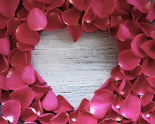 Old Wooden Heart With Rose Petals