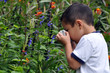 © Richard Susanto - A Child taking a photo of flowers