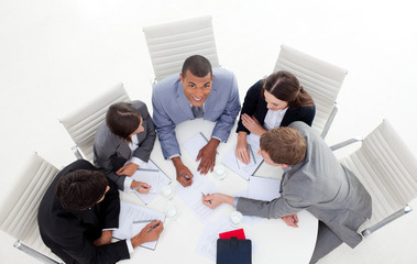 Wall Mural - High angle of a business group sitting around a conference