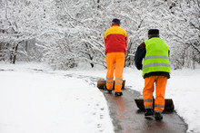 Workers Removing First Snow
