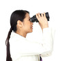 © WavebreakMediaMicro - Visionary businesswoman looking through binoculars