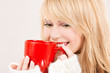 © Syda Productions - happy teenage girl with red mug