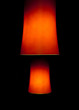 Two red interior lamps in the dark