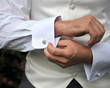 © Cath Bell - Groom checking cufflinks
