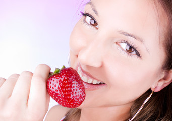 young woman hold  fresh strawberry