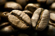 Extreme close-up of roasted coffee beans.