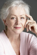© Monkey Business - Studio Portrait Of Smiling Senior Woman