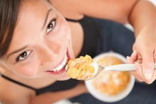 Woman Eating Conflakes Cereals