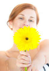 Beautiful woman with gerbera flower